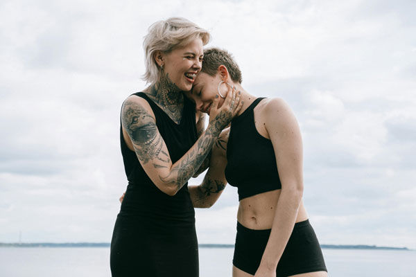 Two women in love laughing with each other